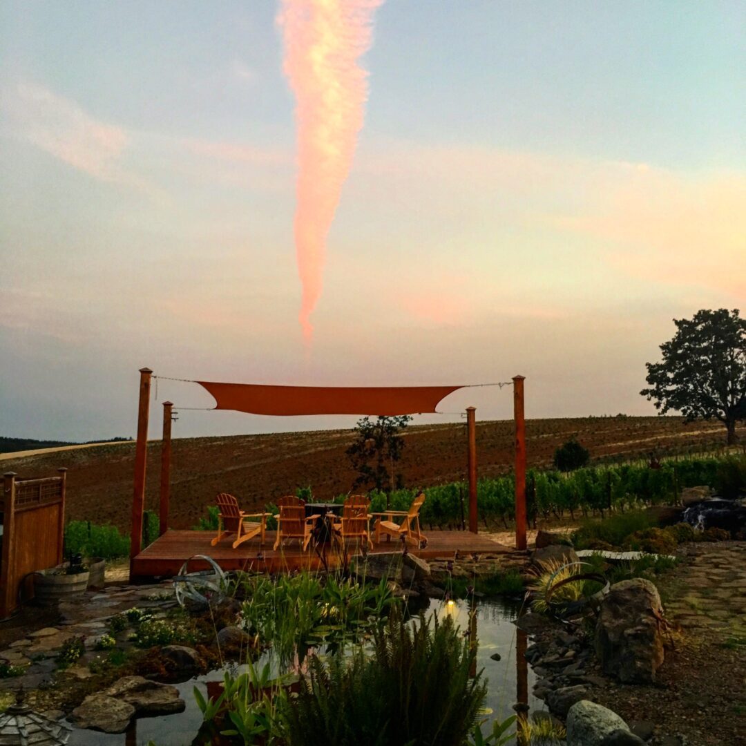 A red fire hydrant is in the middle of an outdoor area.