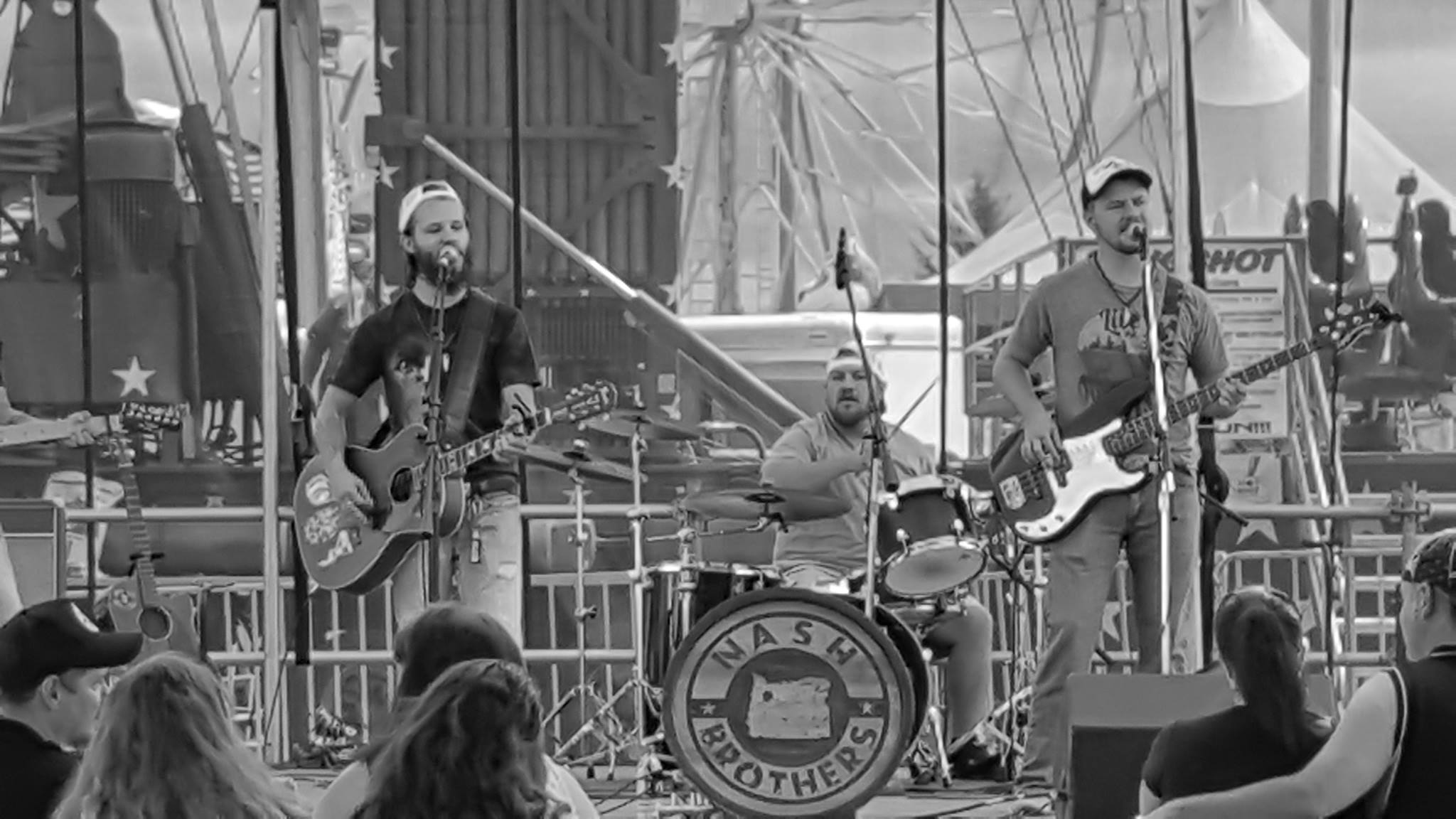 A group of people on stage playing music.