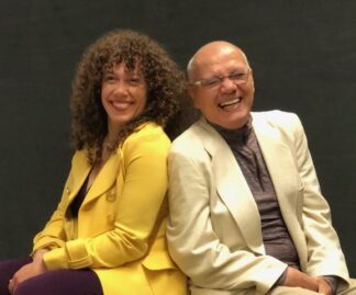 A man and woman sitting next to each other.